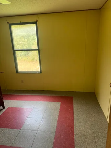 a view of a field with an ocean