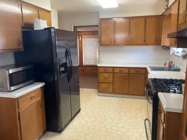 a kitchen with a stove and a sink