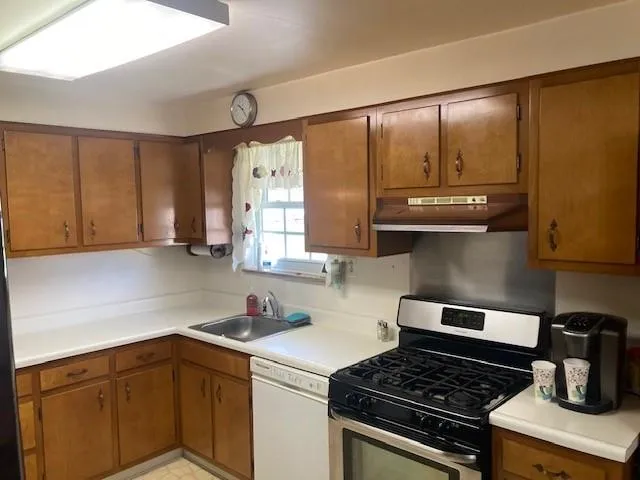 an empty room with closet and windows