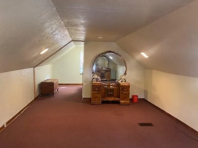 a view of a hallway with a room