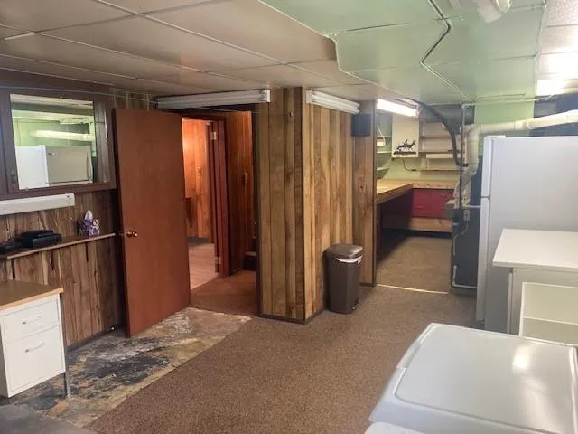 a room with a table chairs and entryway