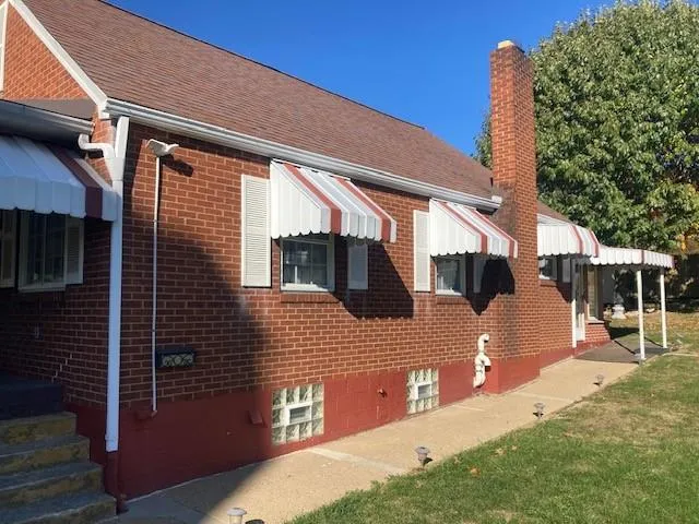 a front view of a house with garden