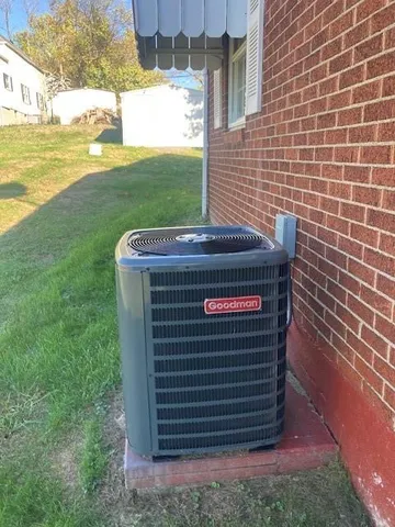 a kitchen with sink a refrigerator and wooden cabinets