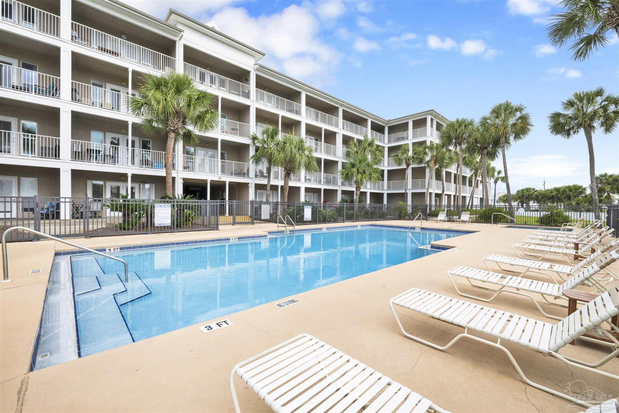 13351 Johnson Beach Road, Unit 203E Perdido Key, FL 32507 - Photo 33 of 55 a view of swimming pool with outdoor seating and city view