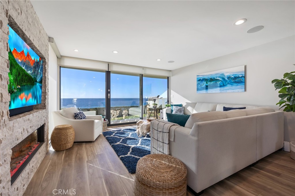 335 West I Street Encinitas, CA 92024 - Photo 2 of 23 a living room with furniture and a flat screen tv