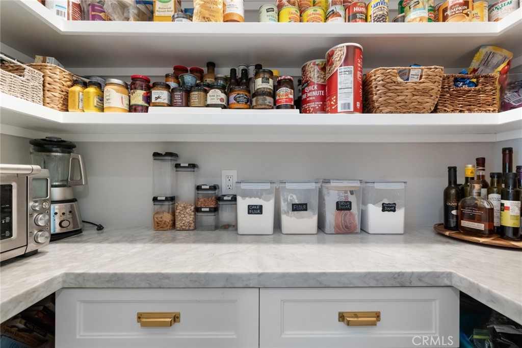 335 West I Street Encinitas, CA 92024 - Photo 9 of 23 a kitchen with a cabinet a wine shelf and cabinets