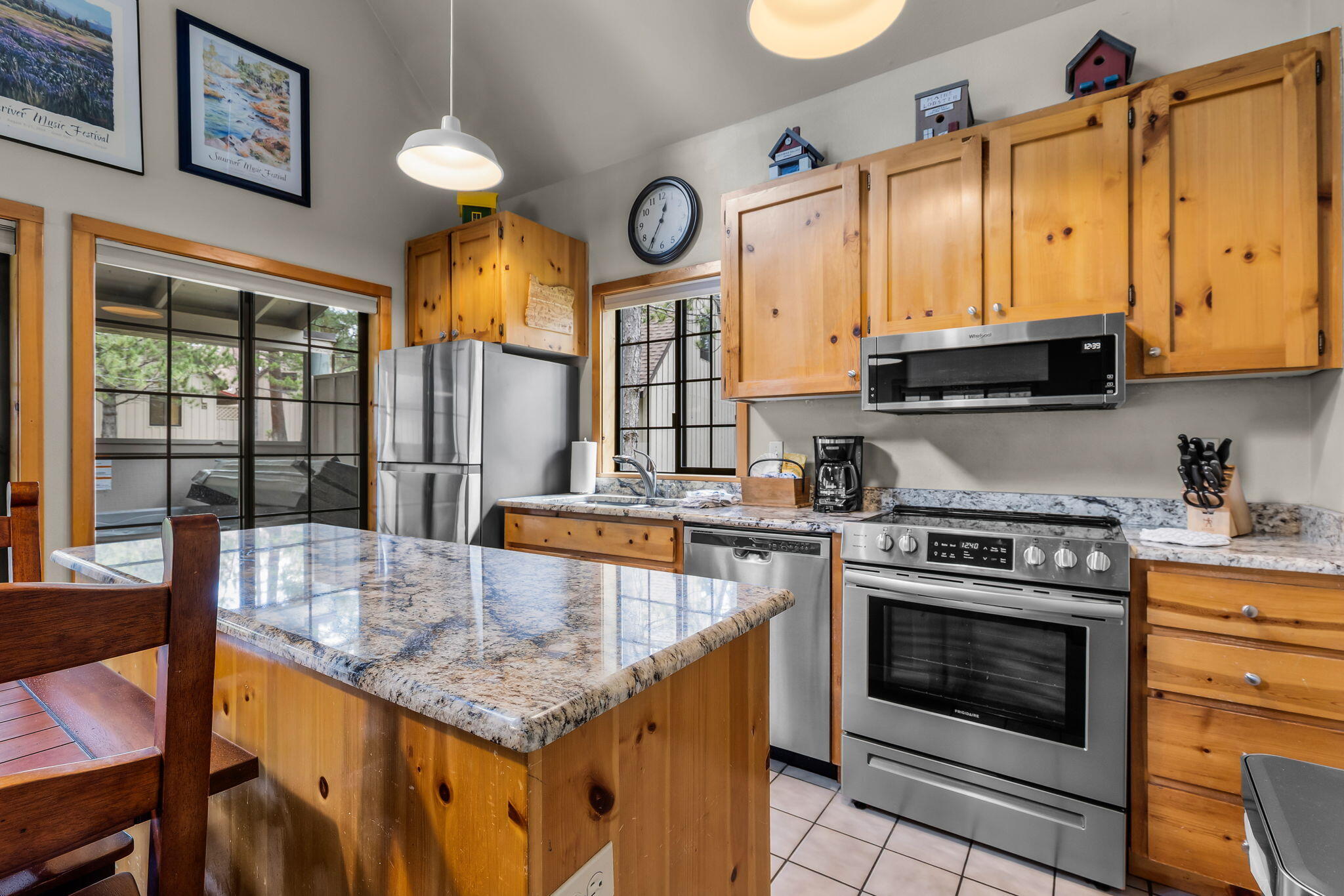 57505 Circle 4 Cabin Road, Unit 29 Sunriver, OR 97707 - Photo 17 of 35 a kitchen with stainless steel appliances granite countertop a stove a sink and a cabinets
