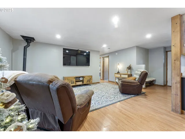 a kitchen with stainless steel appliances granite countertop a refrigerator a sink dishwasher a stove and a microwave oven with cabinets