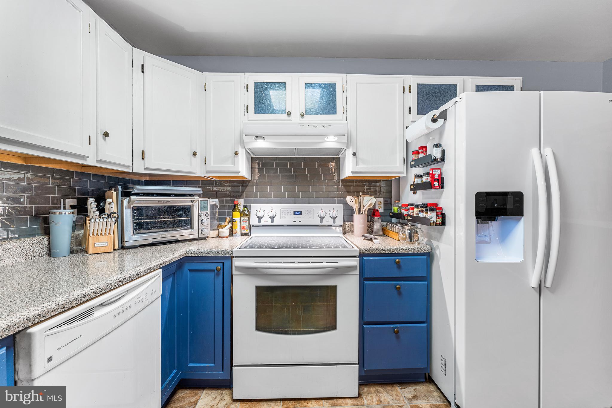 131 Quaker Road Pennsville, NJ 08070 - Photo 12 of 36 a white refrigerator freezer sitting inside of a kitchen