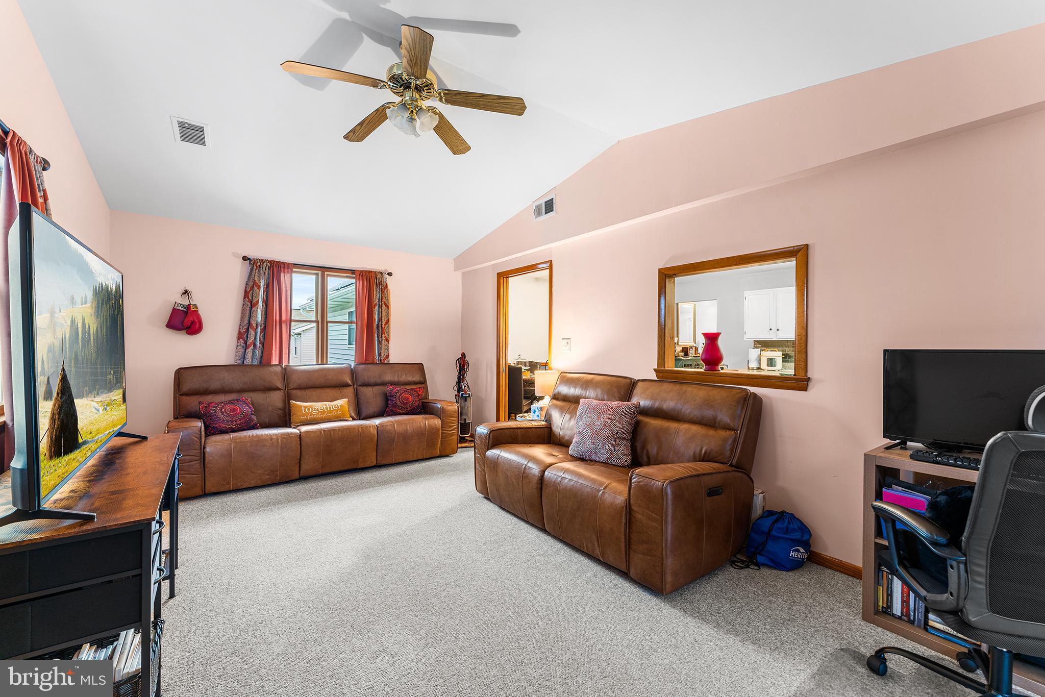 131 Quaker Road Pennsville, NJ 08070 - Photo 16 of 36 a living room with furniture and a flat screen tv
