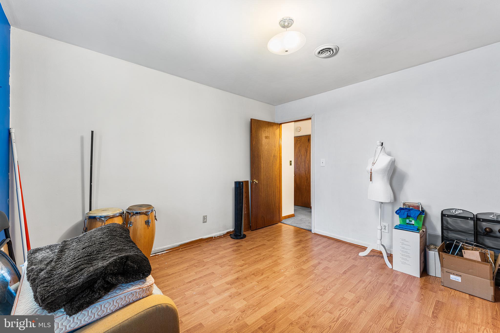131 Quaker Road Pennsville, NJ 08070 - Photo 19 of 36 a bedroom with a bed and a dresser