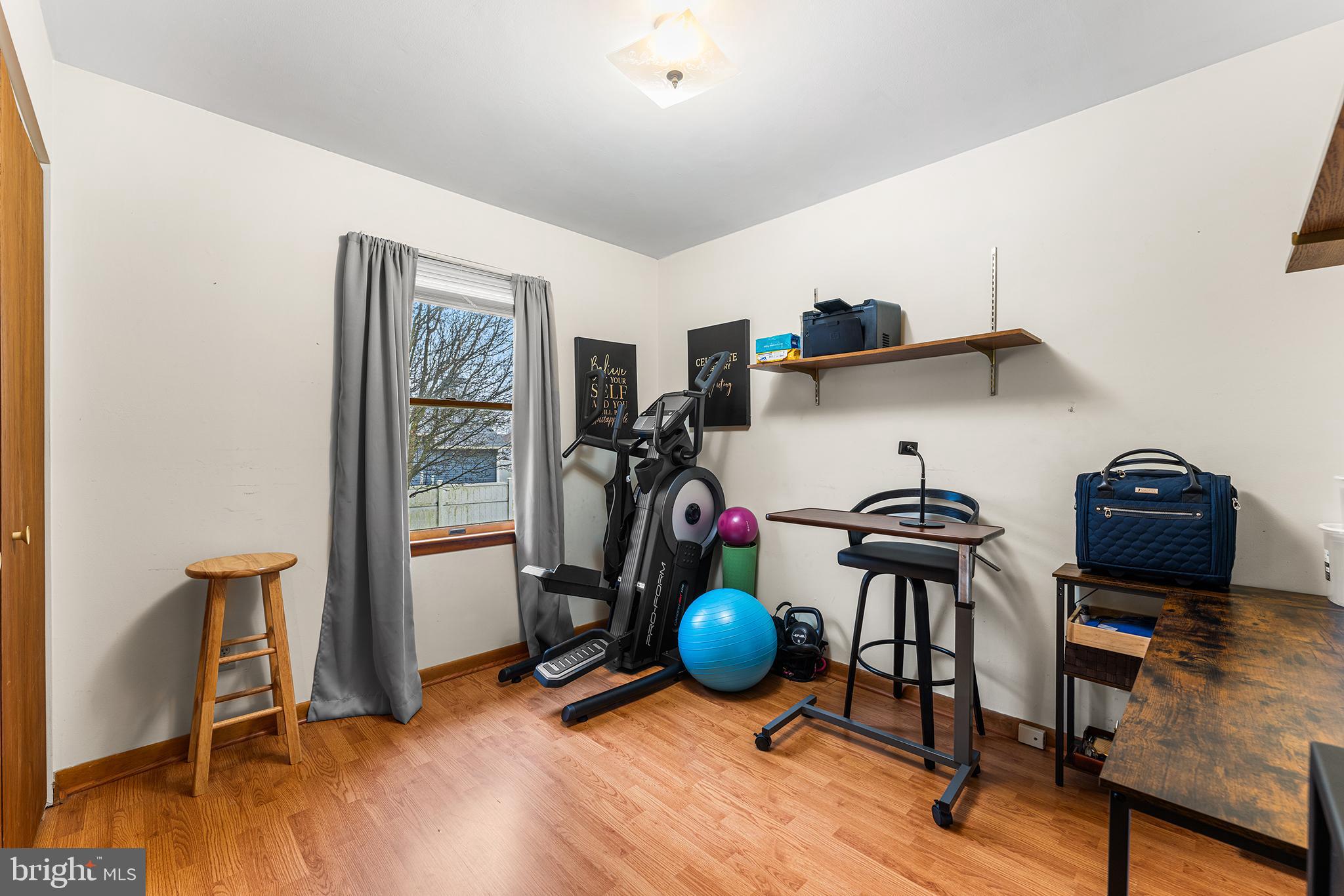 131 Quaker Road Pennsville, NJ 08070 - Photo 21 of 36 a view of a workspace with furniture and wooden floor
