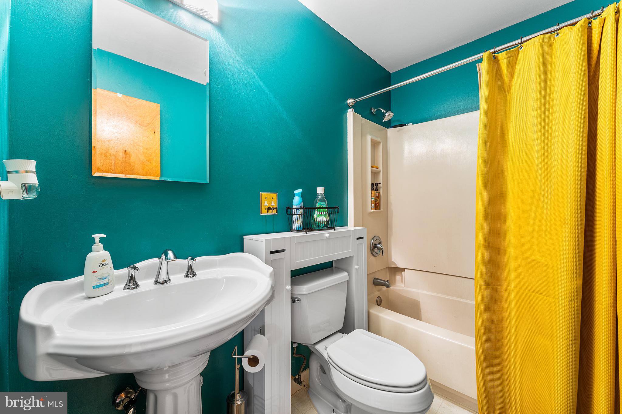 131 Quaker Road Pennsville, NJ 08070 - Photo 24 of 36 a bathroom with a sink a toilet and shower