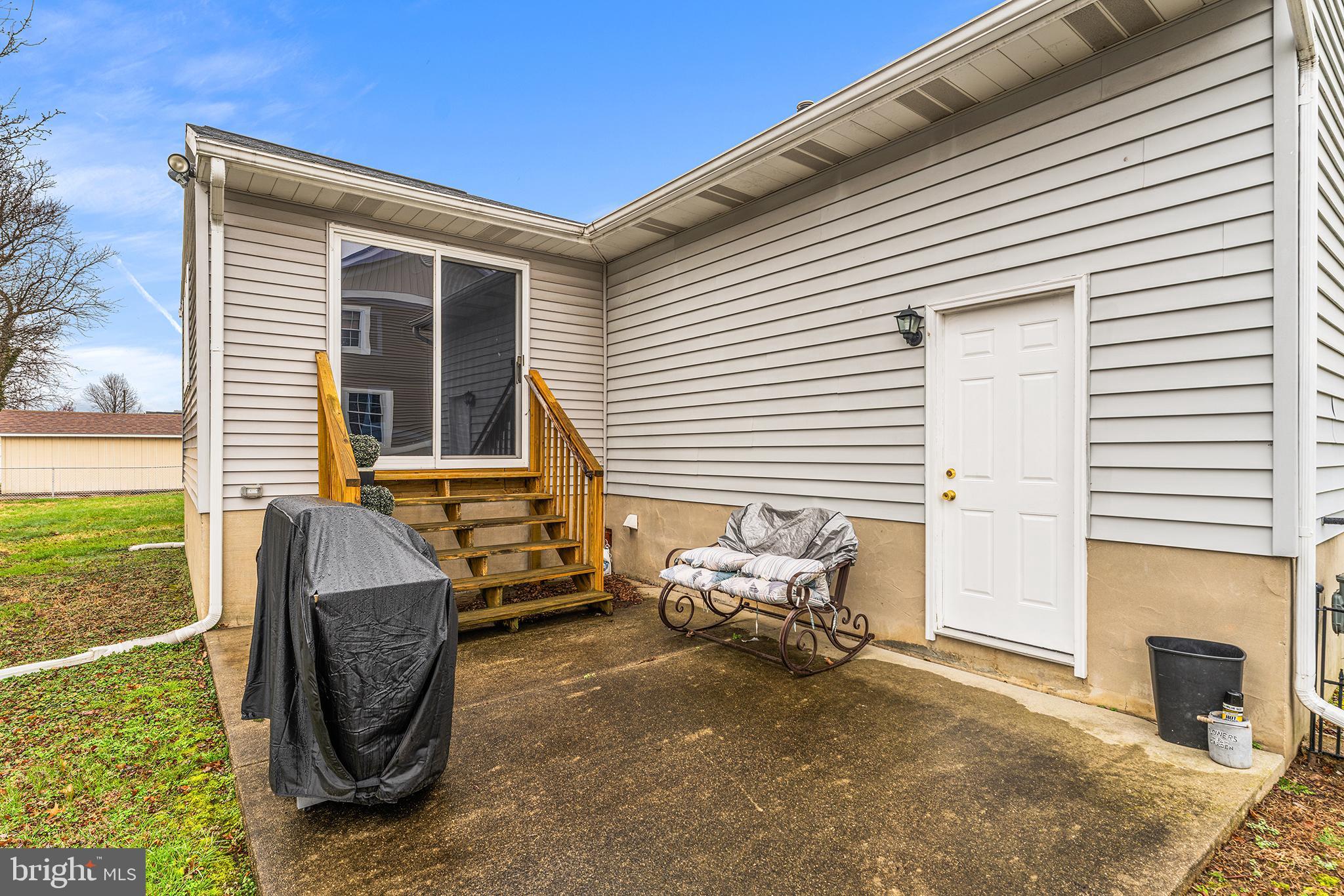 131 Quaker Road Pennsville, NJ 08070 - Photo 32 of 36 a view of a patio with couple of chairs and a fire pit