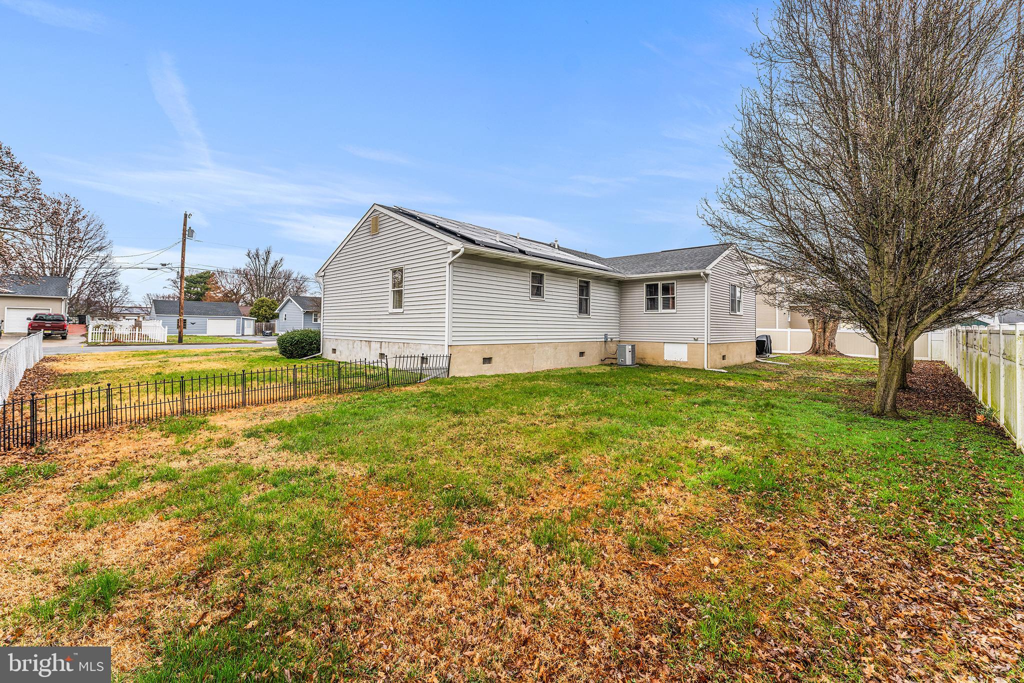 131 Quaker Road Pennsville, NJ 08070 - Photo 35 of 36 a view of a house with a big yard and large trees