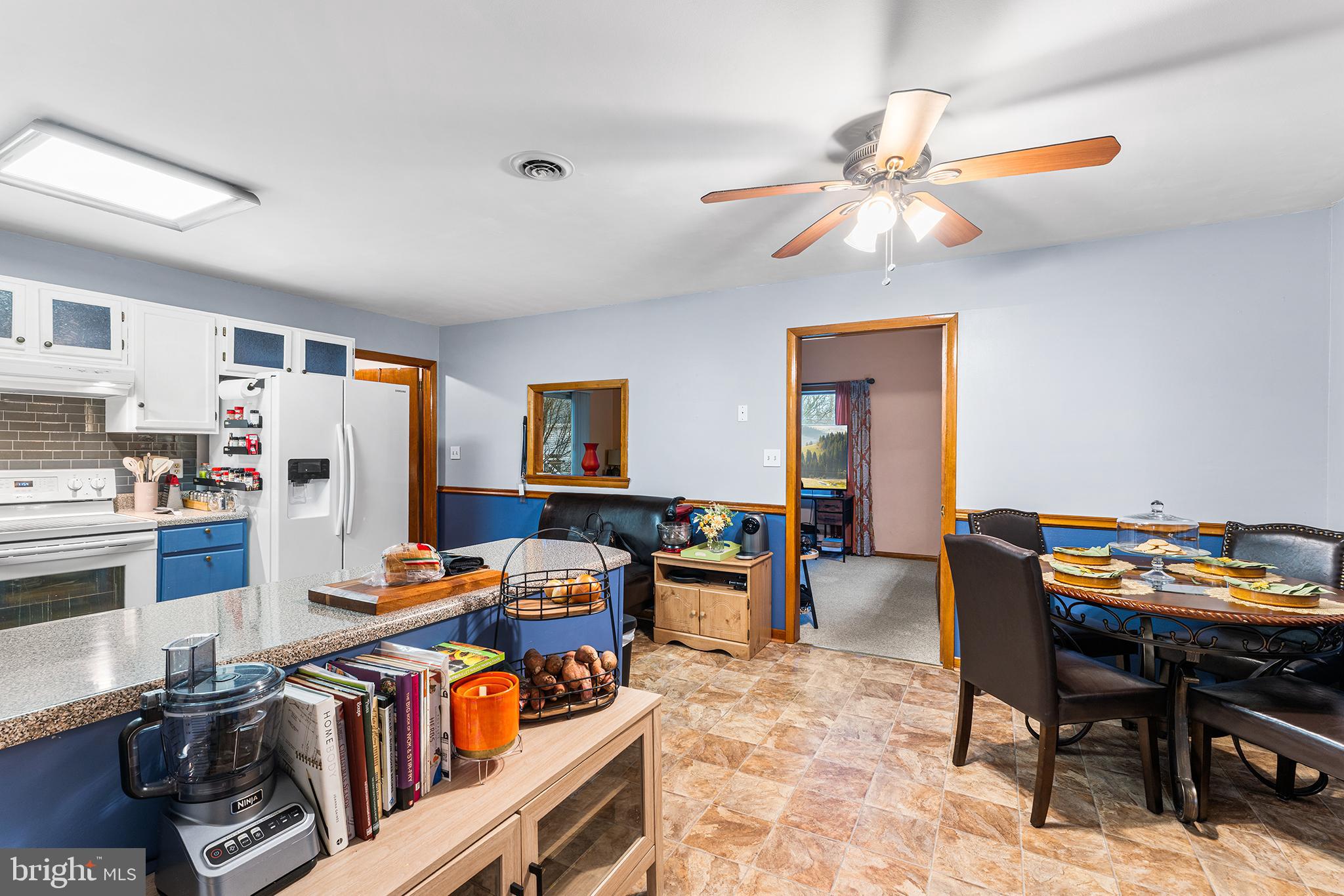 131 Quaker Road Pennsville, NJ 08070 - Photo 8 of 36 a living room with furniture a dining table and chairs with wooden floor