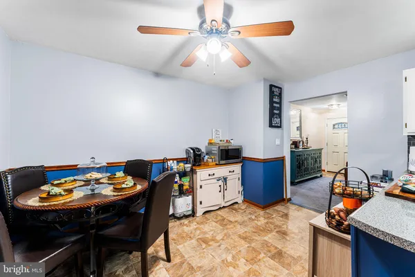 a kitchen with a dining table and chairs