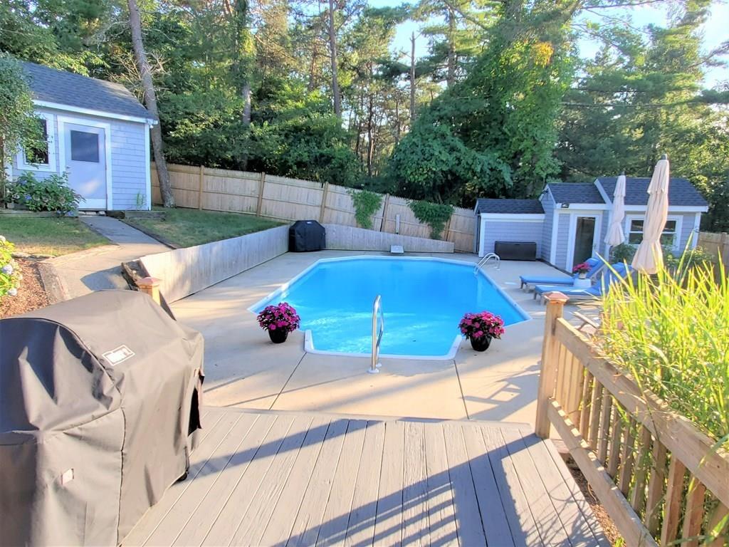 47 Blissful Lane Wareham, MA 02538 - Photo 16 of 24 a view of a patio with chairs and potted plants