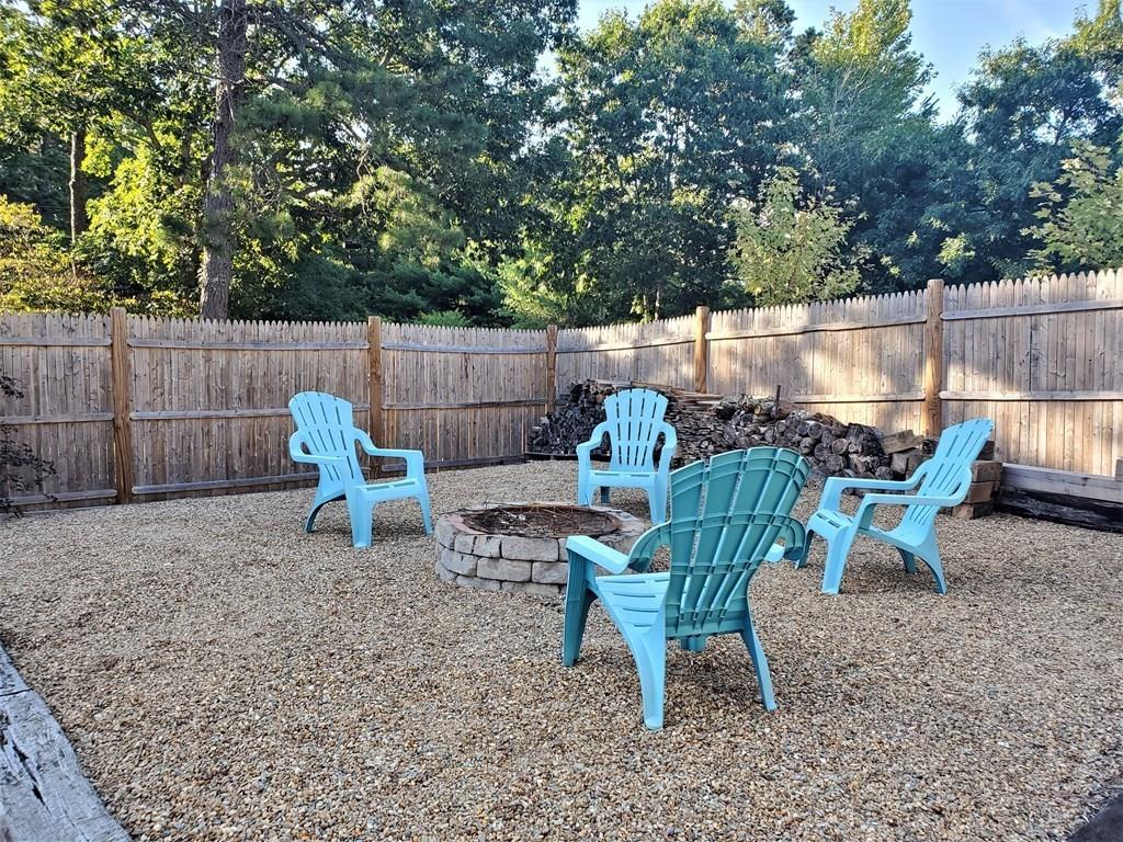 47 Blissful Lane Wareham, MA 02538 - Photo 22 of 24 a view of a backyard with furniture and a slide