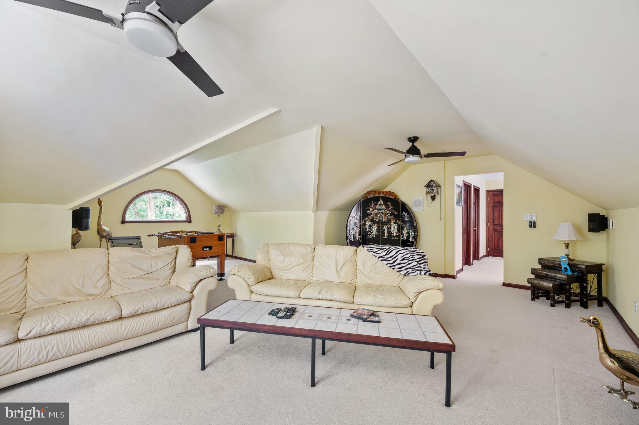 11105 Waddell Road Bumpass, VA 23024 - Photo 54 of 76 a living room with furniture a rug and a ceiling fan