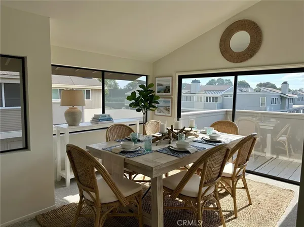 a dining room with furniture and window