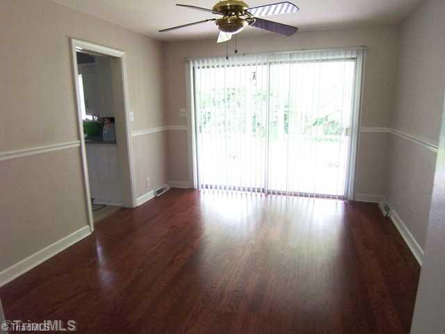 784 Motor Road Winston-Salem, NC 27105 - Photo 5 of 16 Dining Room. Glass sliding door opens to covered porch.