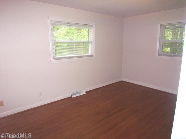 784 Motor Road Winston-Salem, NC 27105 - Photo 10 of 16 2nd Bedroom. Corner windows for easy furniture placement.