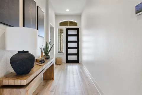 a bedroom with a bed and a chair