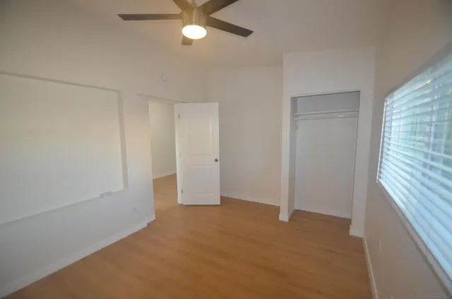 an empty room with fan