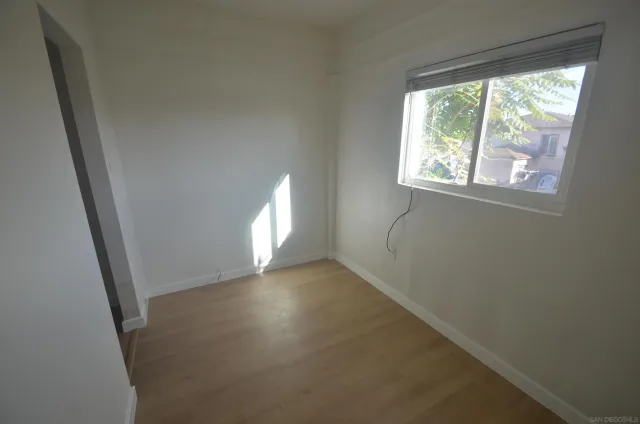 a view of a room that has a window in it