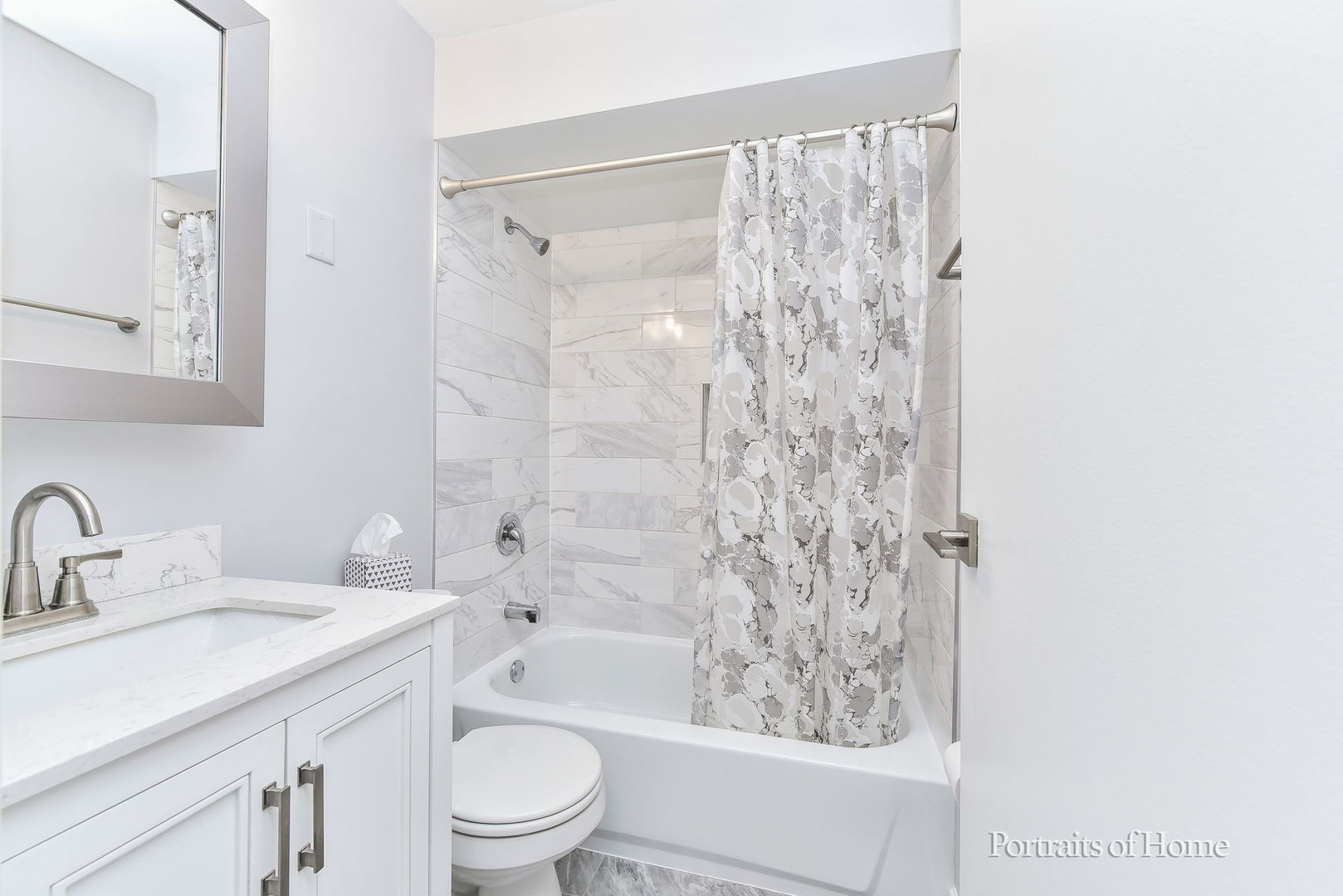 6630 South Brainard Avenue, Unit 203 Countryside, IL 60525 - Photo 17 of 22 a bathroom with a bathtub shower sink vanity and toilet