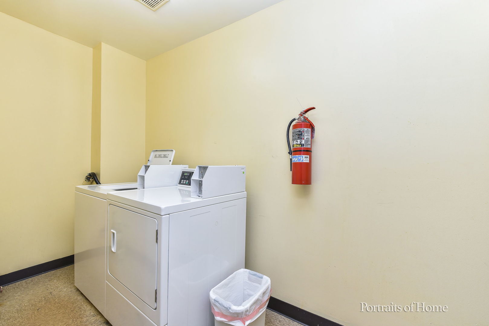 6630 South Brainard Avenue, Unit 203 Countryside, IL 60525 - Photo 19 of 22 a utility room with a sink a toilet and vanity