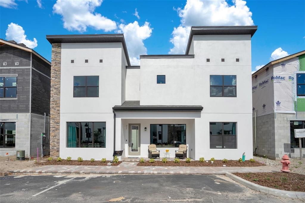 215 Villa Domani Circle Davenport, FL 33896 - Photo 1 of 32 a view of a building with car windows