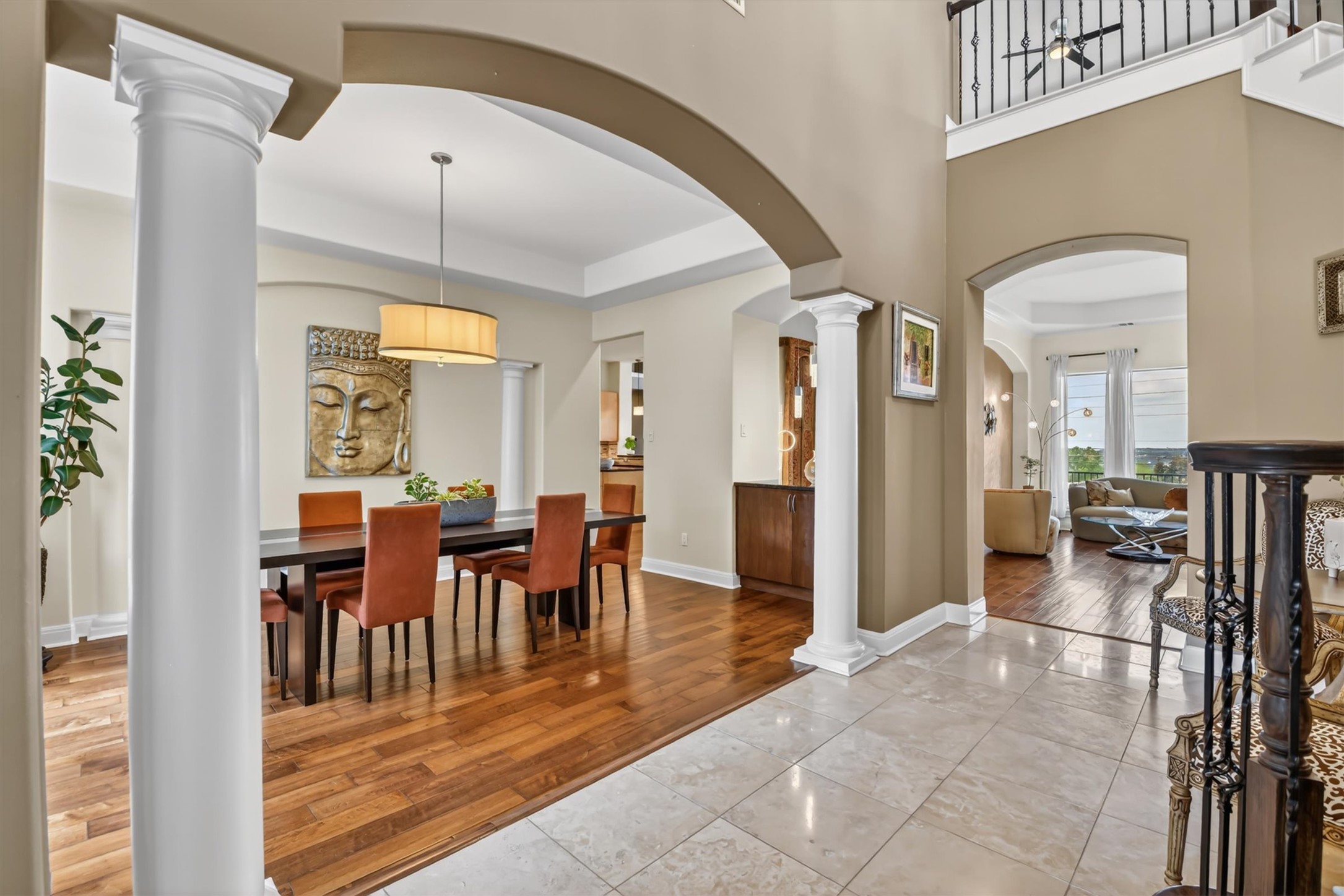 2000 Rio Mesa Drive Austin, TX 78732 - Photo 15 of 39 The entrance features a tile floor that opens to a dining area with hardwood flooring and an overhead light fixture