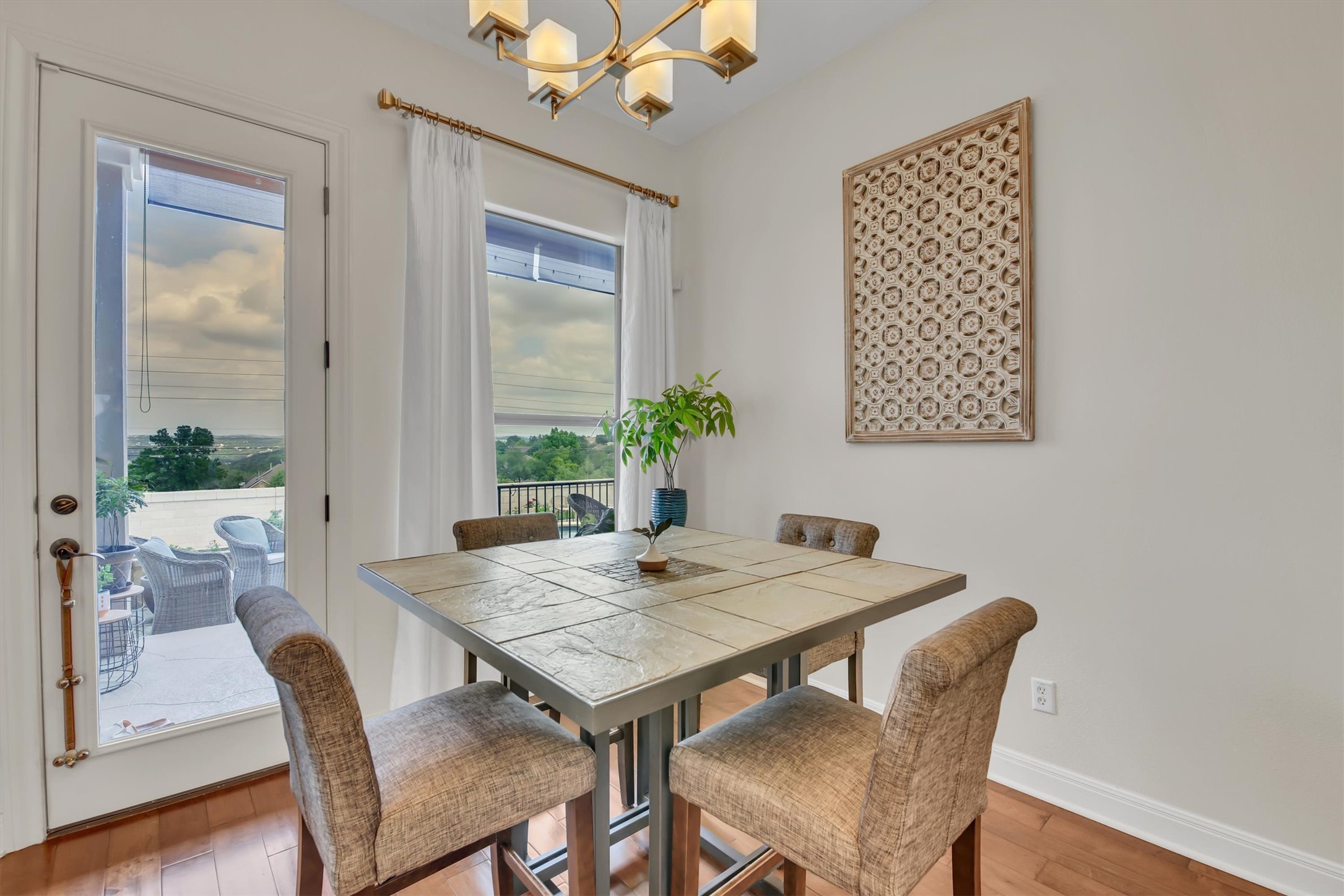 2000 Rio Mesa Drive Austin, TX 78732 - Photo 19 of 39 This dining area features hardwood floors and offers direct access to an outdoor patio through a glass door