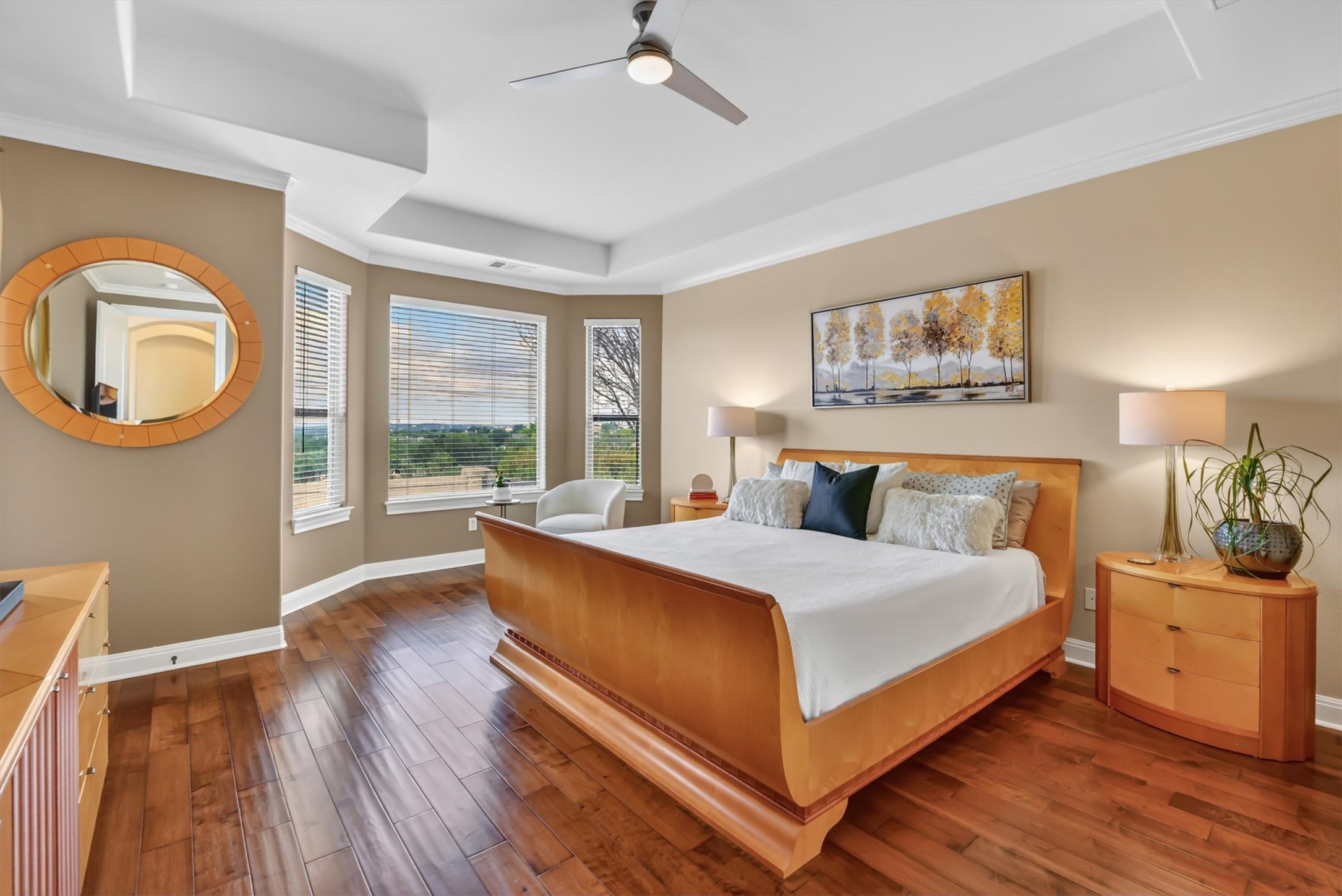2000 Rio Mesa Drive Austin, TX 78732 - Photo 20 of 39 This room features hardwood floors, a tray ceiling, and a ceiling fan