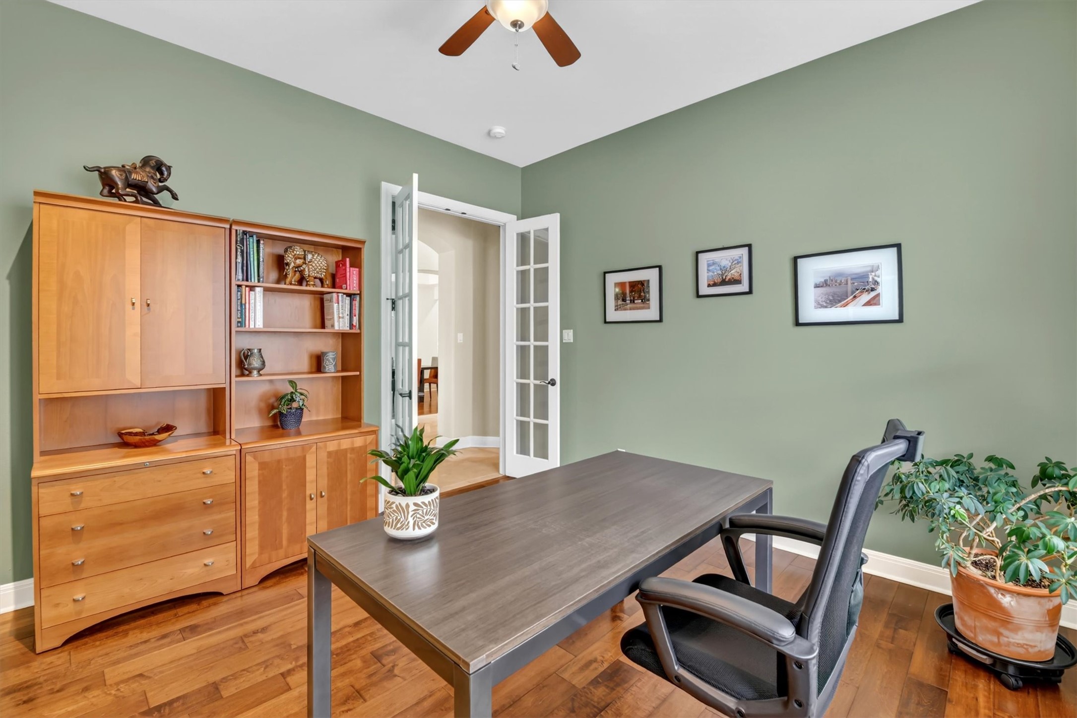 2000 Rio Mesa Drive Austin, TX 78732 - Photo 25 of 39 This property features a room with hardwood flooring, light green walls, and white trim