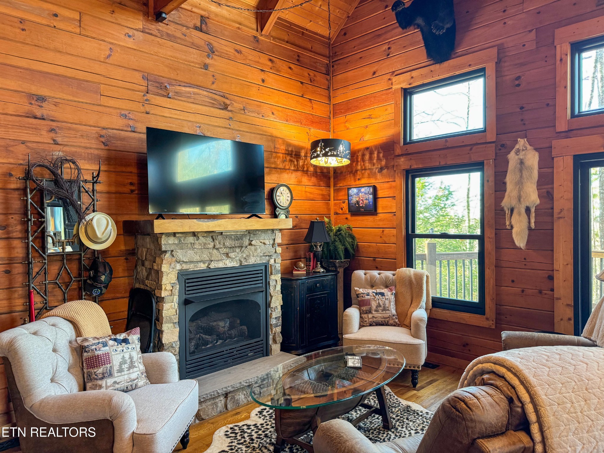 390 John J Smith Road Oneida, TN 37841 - Photo 12 of 56 a living room with furniture a fireplace and a flat screen tv