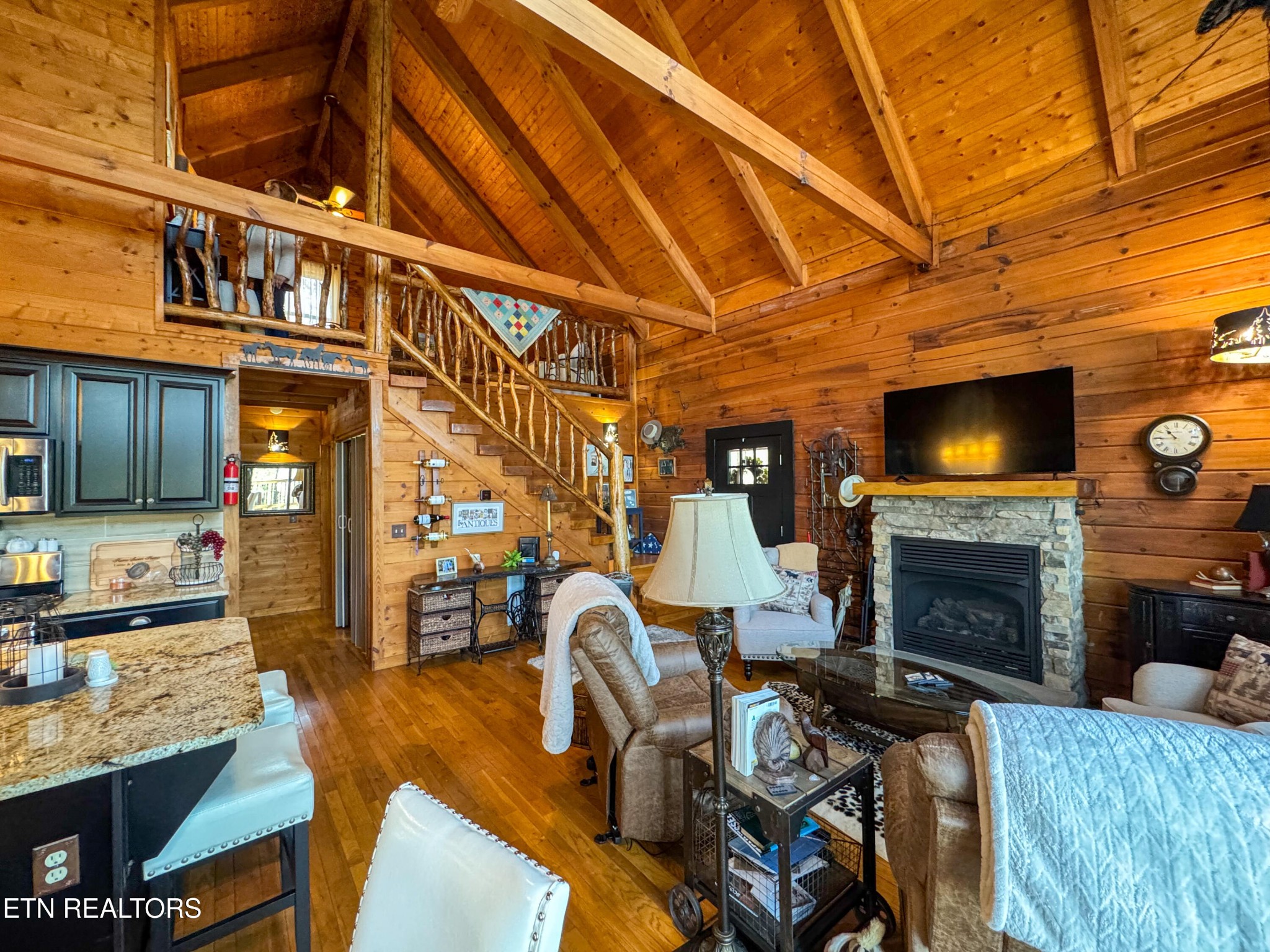 390 John J Smith Road Oneida, TN 37841 - Photo 14 of 56 a living room with furniture a flat screen tv and a fireplace