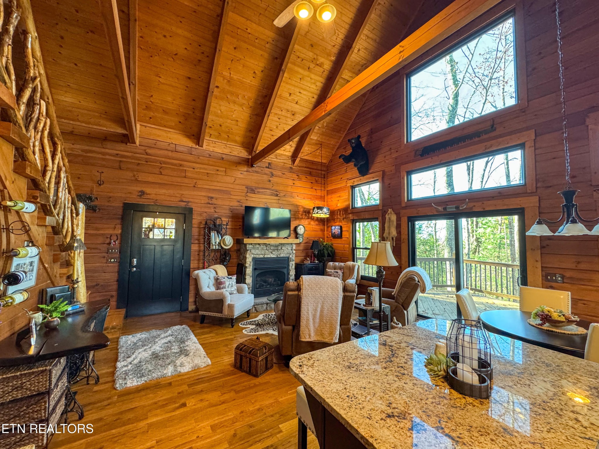 390 John J Smith Road Oneida, TN 37841 - Photo 18 of 56 a view of a dining room with furniture a chandelier and windows