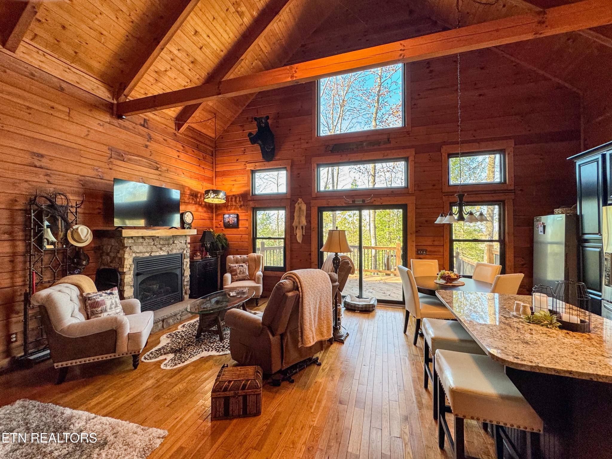 390 John J Smith Road Oneida, TN 37841 - Photo 20 of 56 a living room with fireplace furniture and a large window