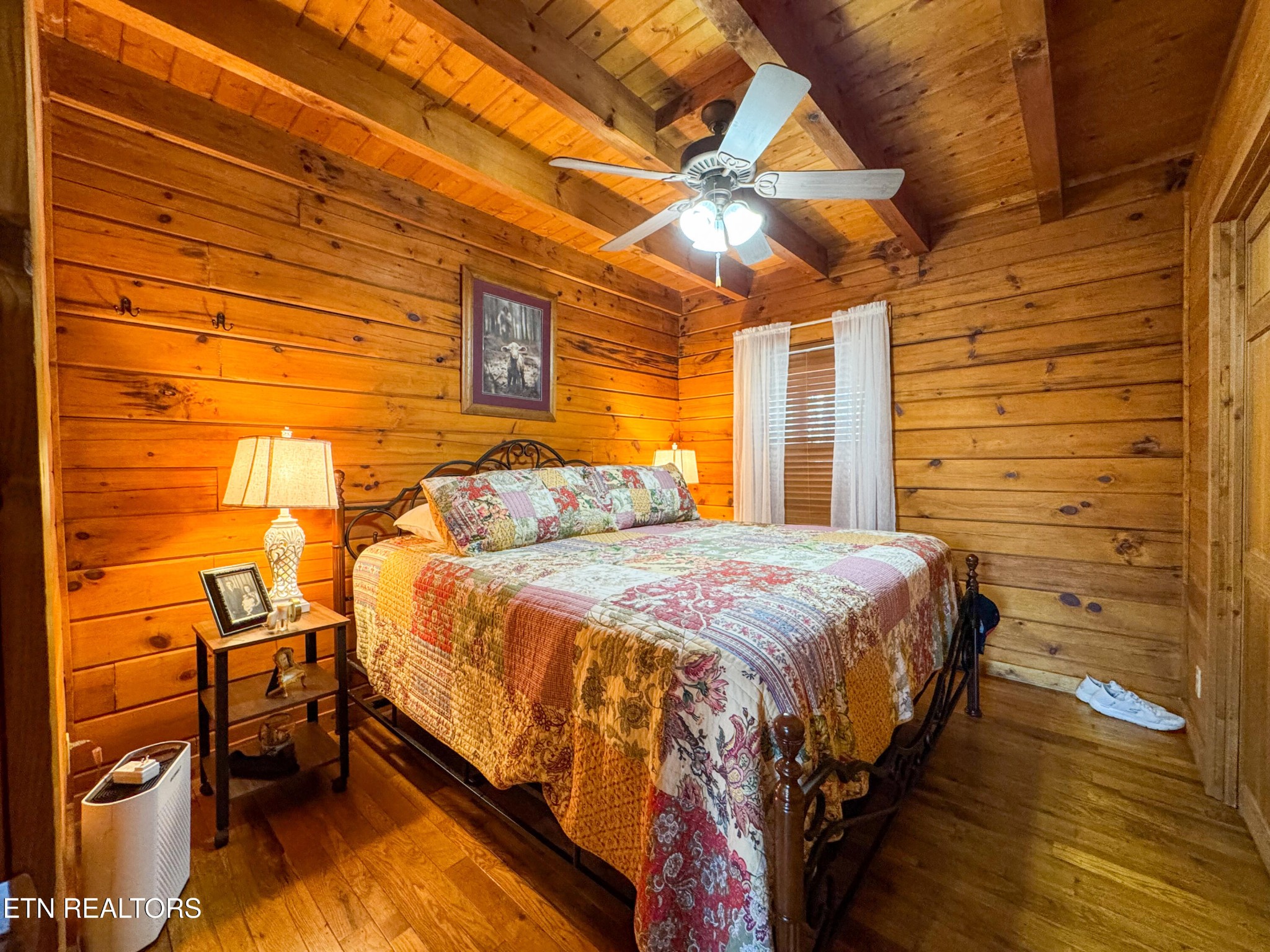 390 John J Smith Road Oneida, TN 37841 - Photo 21 of 56 a bed sitting in a bedroom next to a blue wall