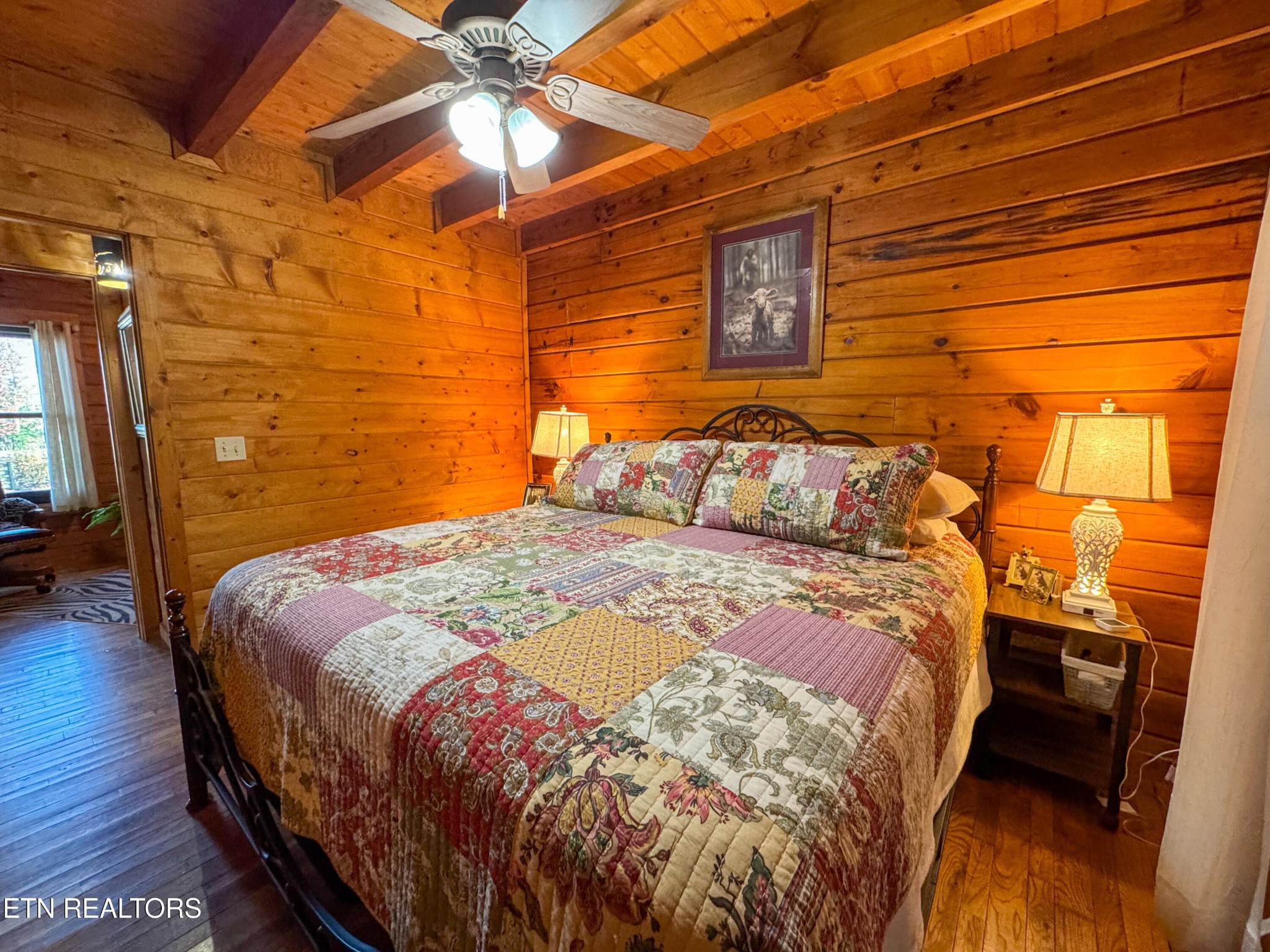 390 John J Smith Road Oneida, TN 37841 - Photo 22 of 56 a bedroom with a bed and wooden floor