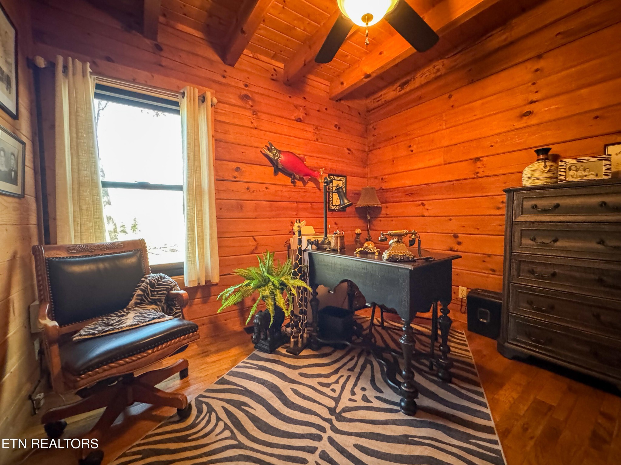 390 John J Smith Road Oneida, TN 37841 - Photo 23 of 56 a view of a balcony with chairs and wooden floor