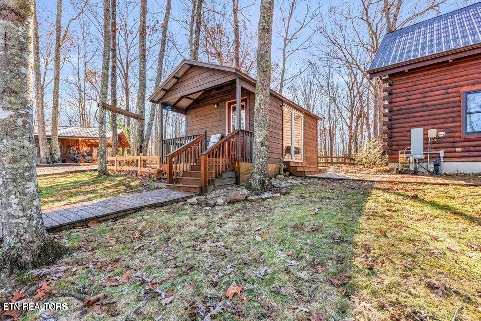 390 John J Smith Road Oneida, TN 37841 - Photo 37 of 56 a view of a house with a snow on the road