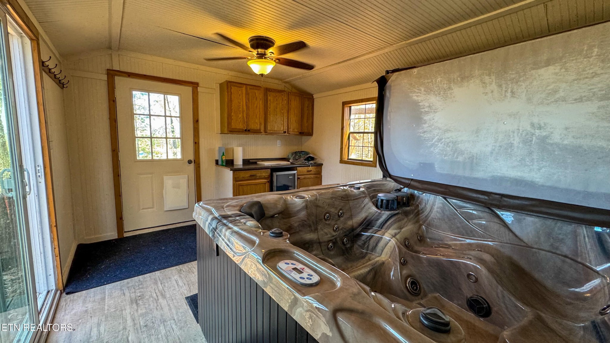 390 John J Smith Road Oneida, TN 37841 - Photo 40 of 56 a kitchen with a stove a sink and a microwave