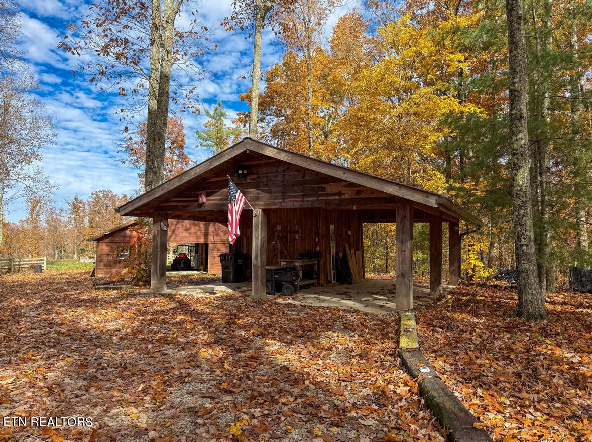 390 John J Smith Road Oneida, TN 37841 - Photo 42 of 56 a view of a house with a large tree
