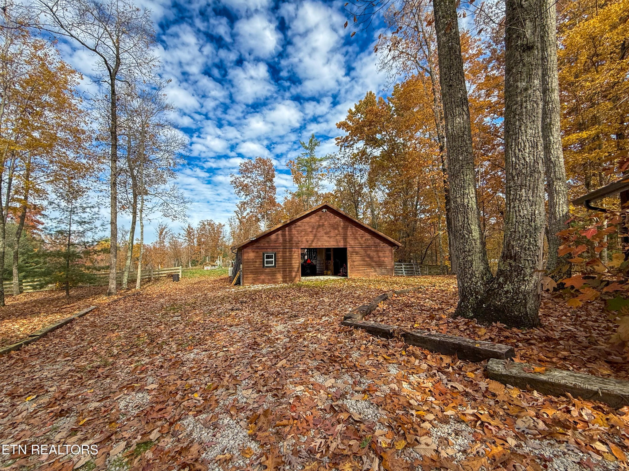 390 John J Smith Road Oneida, TN 37841 - Photo 45 of 56 a white house that has a tree in front of it
