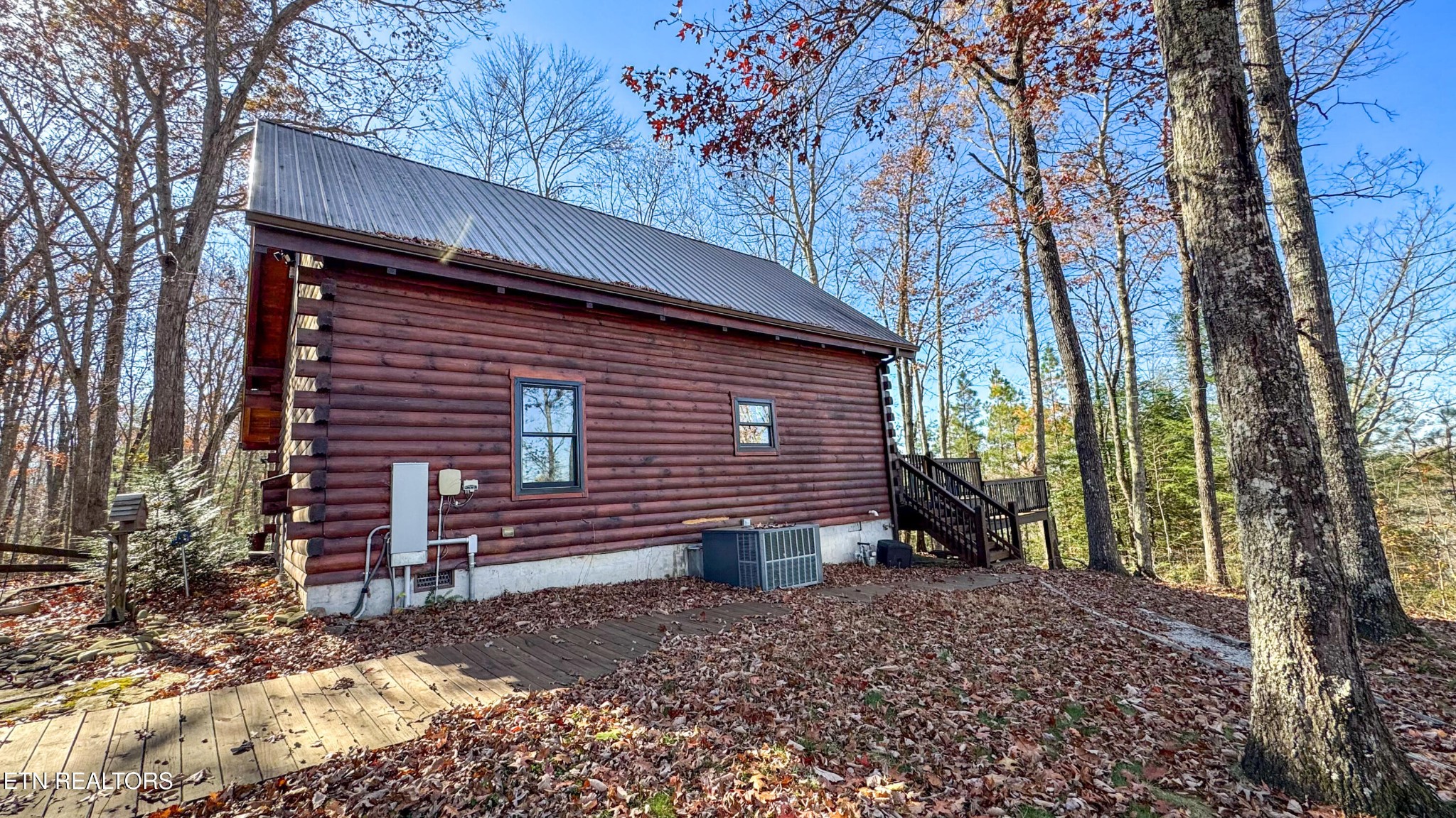 390 John J Smith Road Oneida, TN 37841 - Photo 5 of 56 a view of a house with a yard and large tree