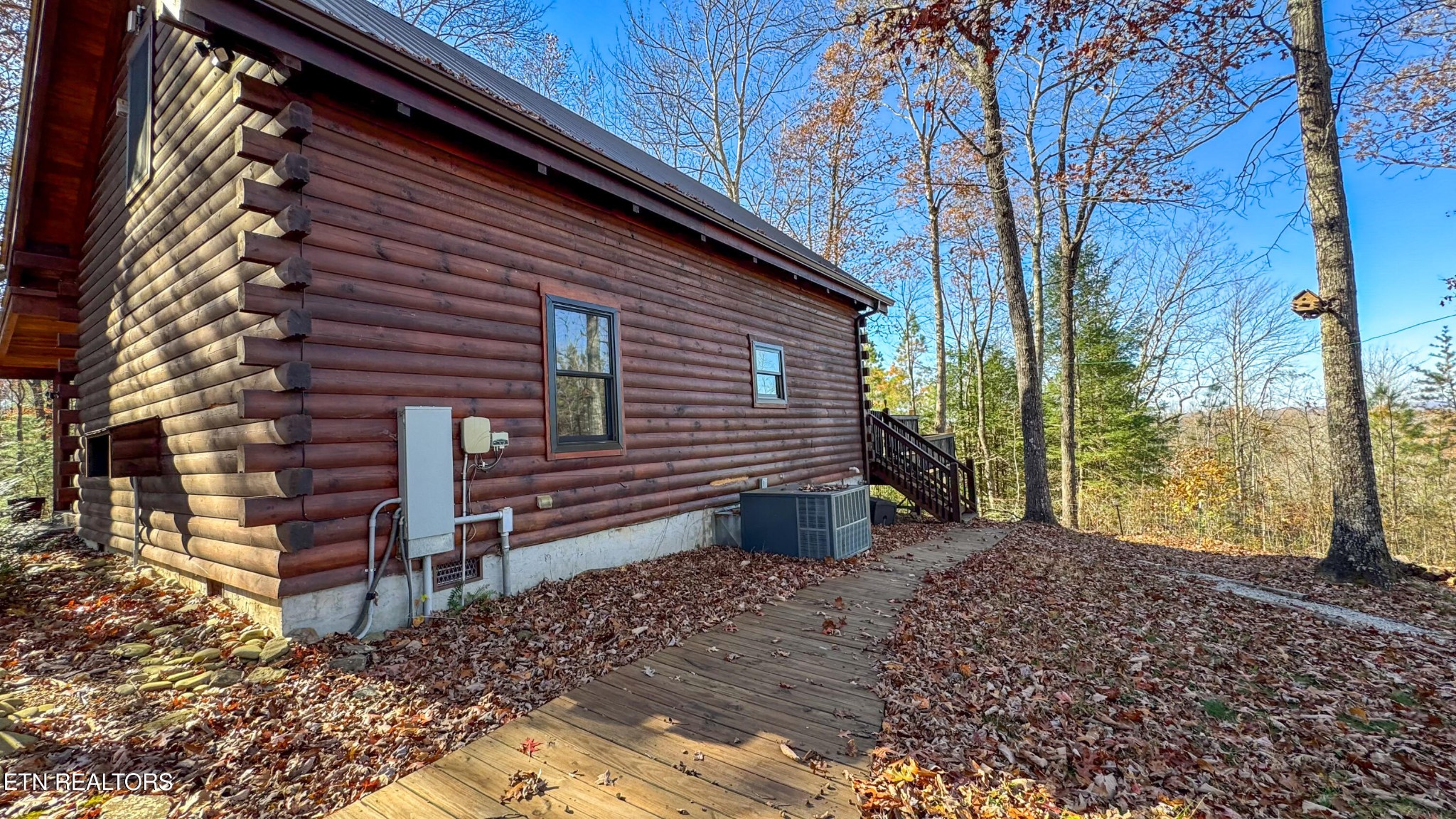390 John J Smith Road Oneida, TN 37841 - Photo 6 of 56 a view of house with backyard and trees